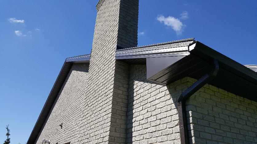 dark grey soffit, fascia and gutters/eavestrough